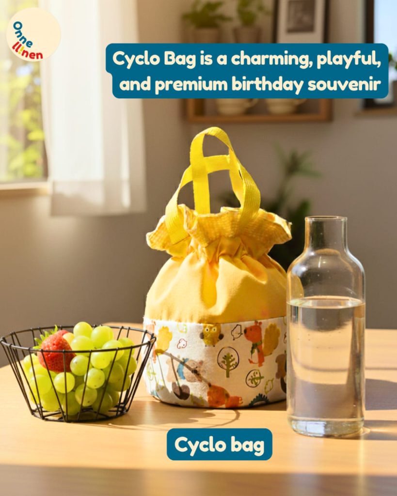 Cyclo Bag Onnellinen berwarna kuning serut dengan motif katun halus, ideal sebagai souvenir ulang tahun premium atau tas bekal