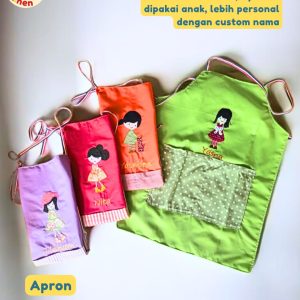 Apron anak bahan katun warna cerah dengan aplikasi bordir karakter anak lucu untuk aktivitas memasak dan melukis.