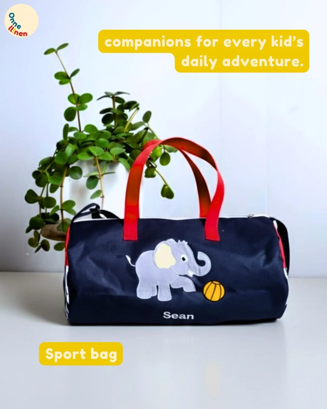 Sport Bag tabung custom dongker (biru tua) aplikasi gajah bermain bola dengan bordir nama Erica, souvenir anak aktif.