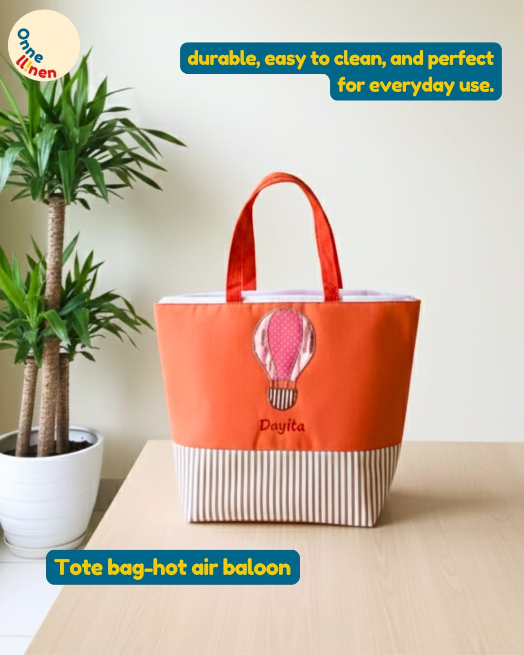 Totebag anak warna cerah dengan aplikasi kain gambar balon udara warna-warni dan bordir nama anak.